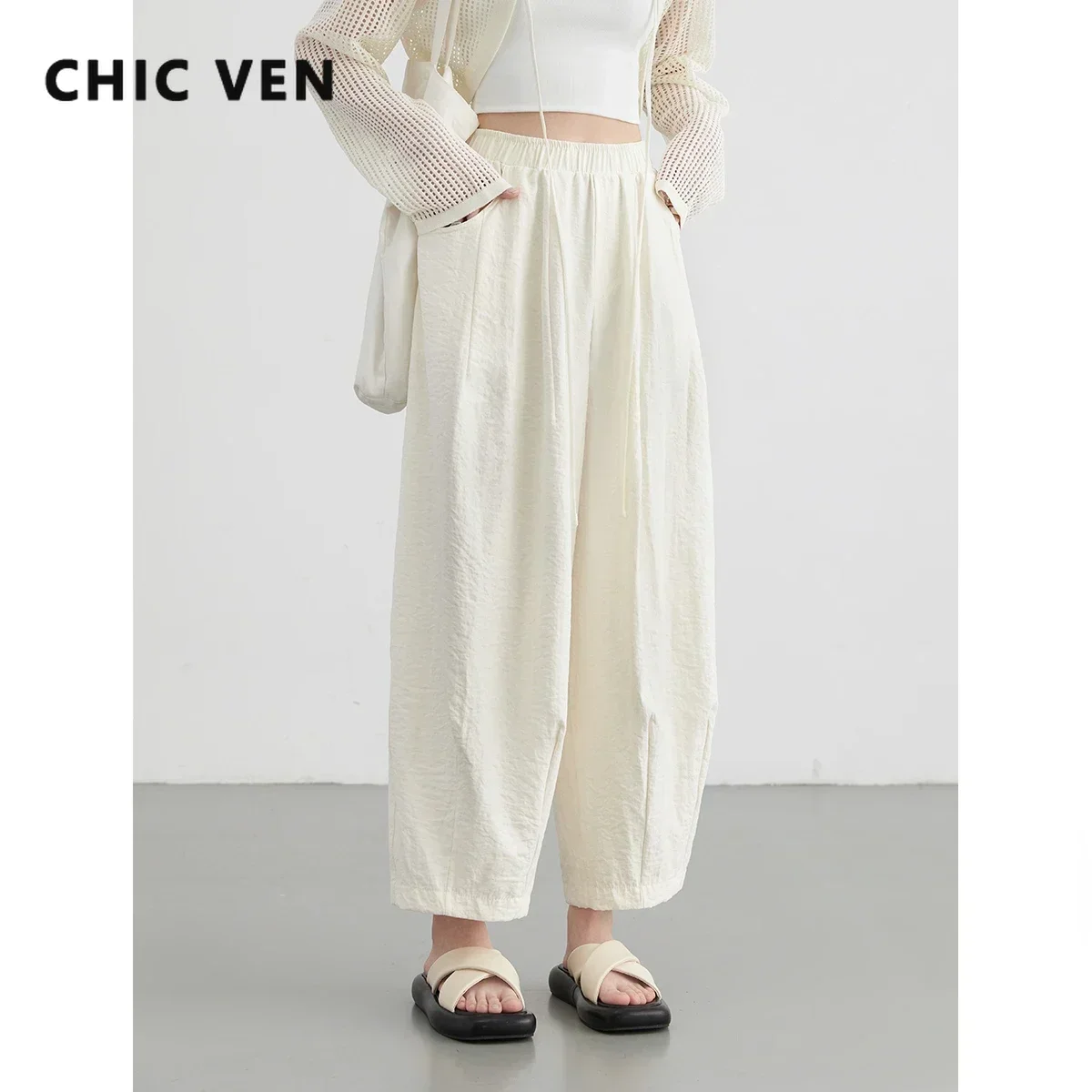 S5e69757f6fec48369eef0549a7d90f71j.webp CHIC VEN Women White Pants Solid Casual Elastic Waist High Waisted Pleated Wide Leg Female Trousers Fold Summer 2025 Clothing - Image 1